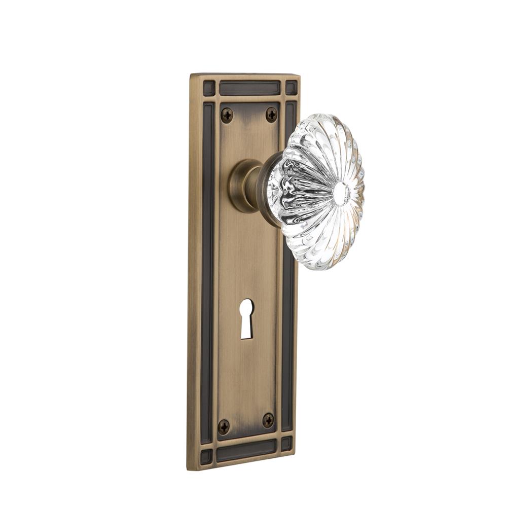 Nostalgic Warehouse MISOFC Privacy Knob Mission Plate with Oval Fluted Crystal Knob and Keyhole in Antique Brass